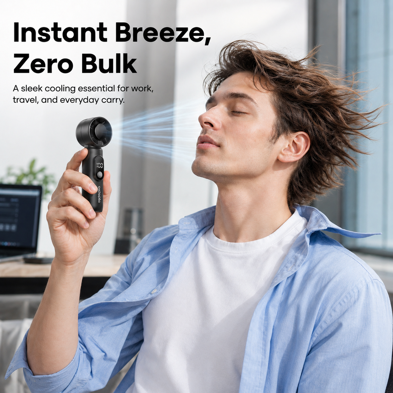 Black pocket-size handheld mini fan for office and travel cooling